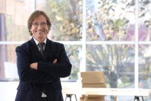 Office employee in front of a window