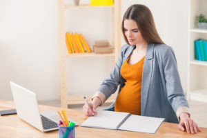 A pregnant woman at work