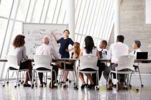 Pregnant woman leading a meeting