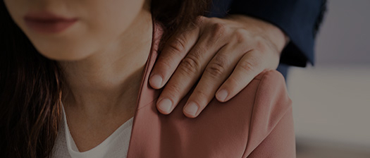 Man Touching a Women on the Shoulder