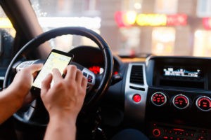 ridesharing driver looking at map on phone