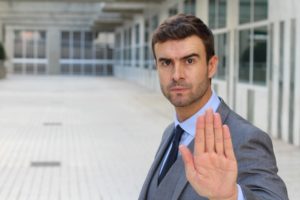 business person stopping sexual harassment in the workplace