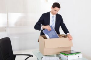 Fired employee packing away things