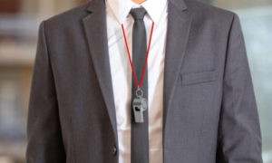 man in suit and tie with a whistle